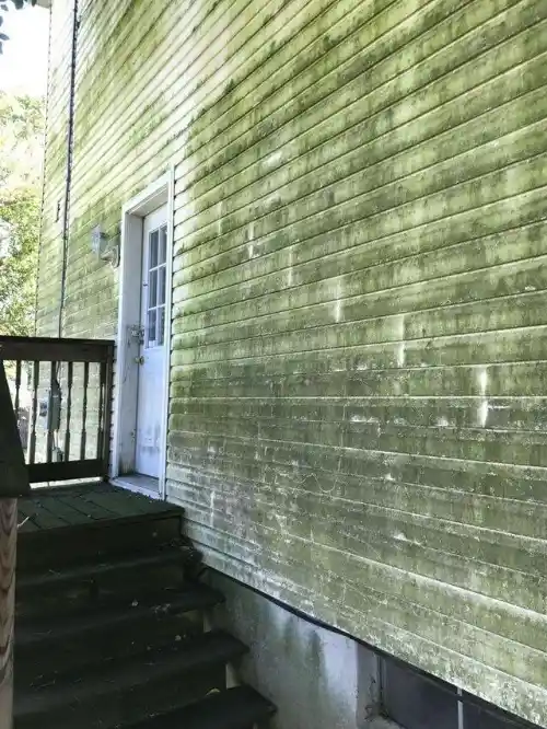 Stained exterior siding before house washing