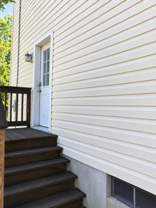 Restored exterior siding after house washing